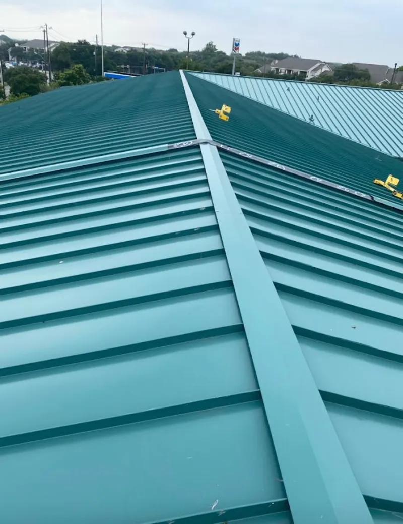 Green commercial metal roof ridge and valley for Metal Roof Repair in Stillwater